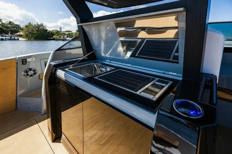  Yacht Photos Pics 2024 Rio Yachts Daytona 50 outdoor kitchen with grill and sleek design.