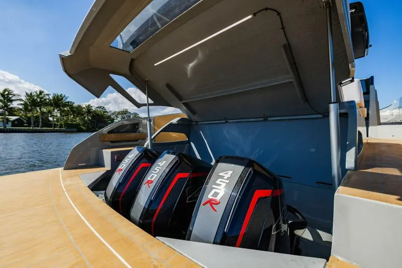  Yacht Photos Pics 2024 Rio Yachts Daytona 50 with triple outboard engines, docked by a scenic waterfront.