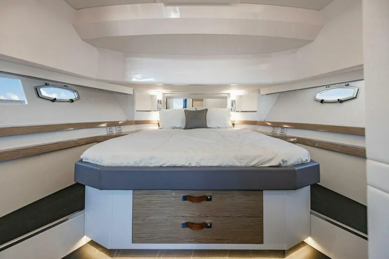  Yacht Photos Pics Luxurious bedroom interior of 2024 Rio Yachts Daytona 50 with modern design and cozy bedding.