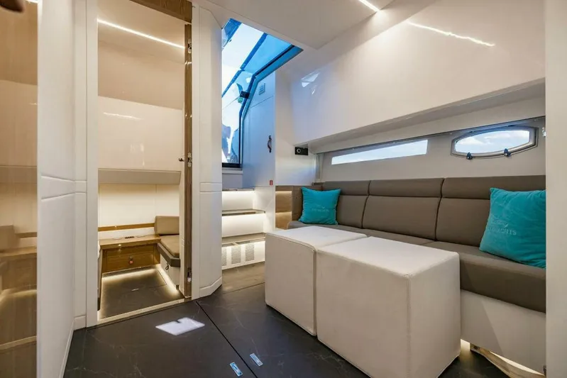  Yacht Photos Pics Luxurious interior of 2024 Rio Yachts Daytona 50, featuring modern seating and ambient lighting.