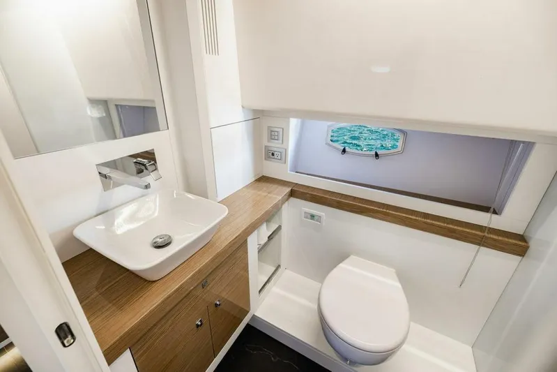  Yacht Photos Pics Luxurious bathroom in 2024 Rio Yachts Daytona 50, featuring modern sink and ocean view.