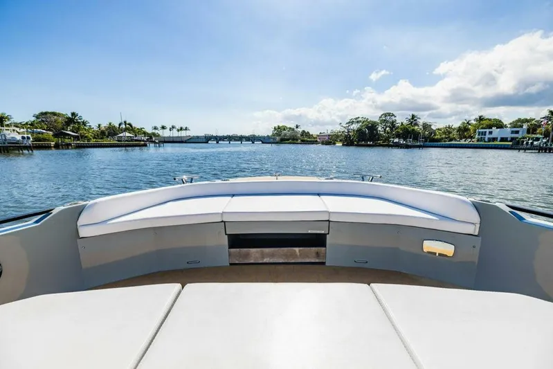 Yacht Photos Pics 2024 Rio Yachts Daytona 50 bow view, featuring spacious seating and scenic waterway backdrop.