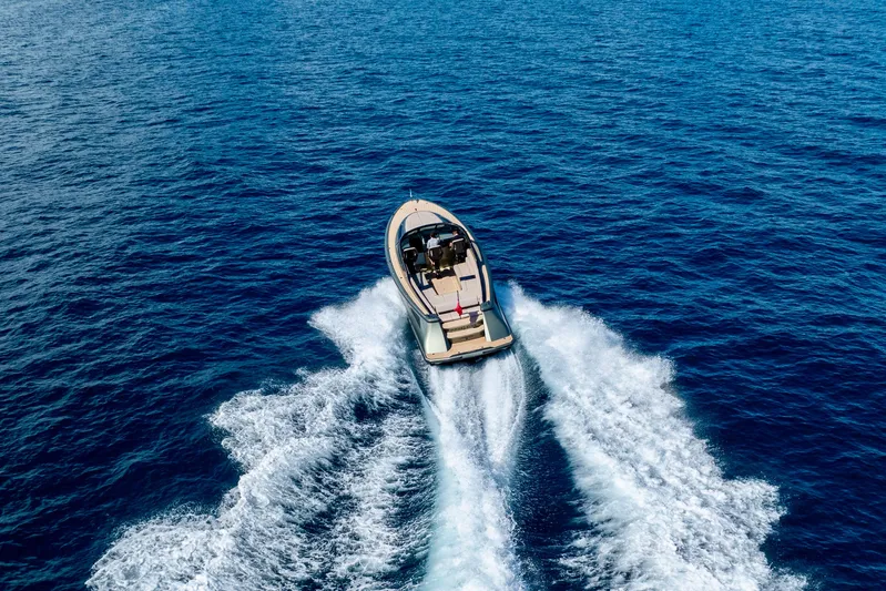 Madeleine Yacht Photos Pics 2024 Wajer 38 yacht cruising on open blue sea, aerial view.