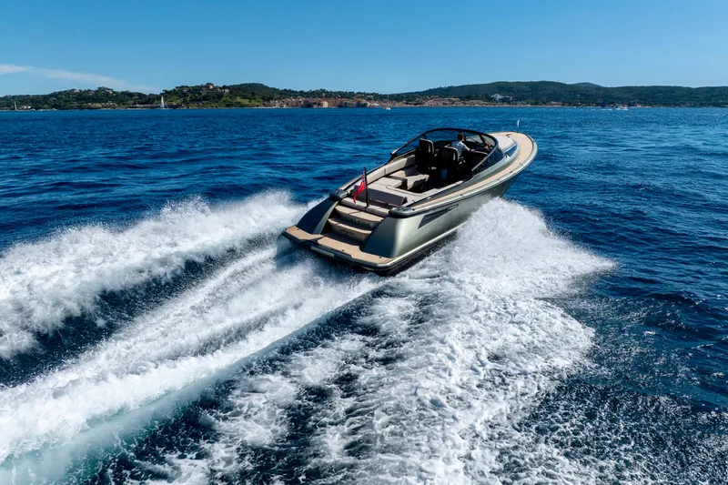 Madeleine Yacht Photos Pics 2024 Wajer 38 yacht cruising on open sea with scenic coastline backdrop.