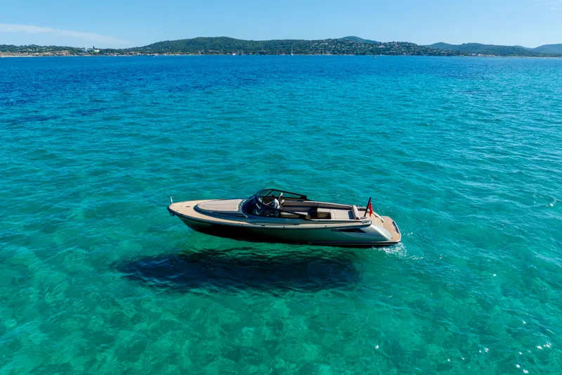 Madeleine Yacht Photos Pics 2024 Wajer 38 yacht cruising on clear blue waters, scenic coastal backdrop.