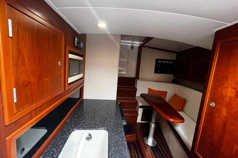  Yacht Photos Pics Luxurious interior of 2010 Scopinich 35 EXPRESS yacht with wood finishes and modern amenities.