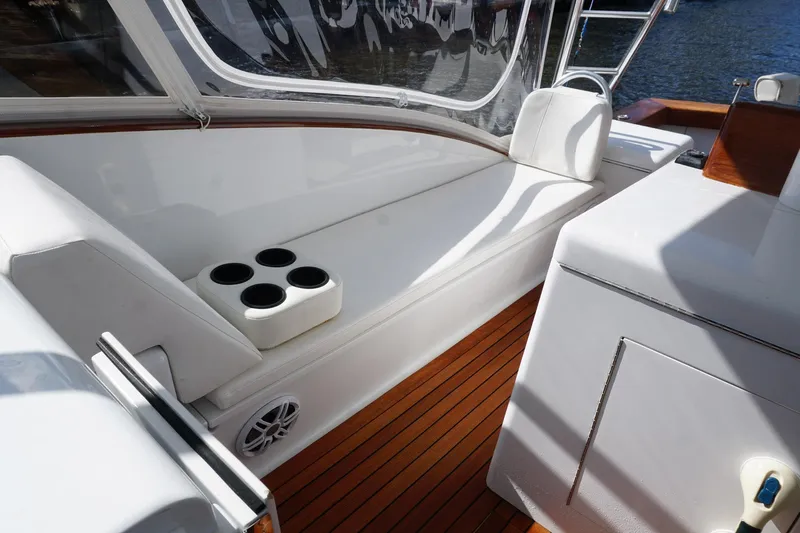  Yacht Photos Pics Luxurious 2010 Scopinich 35 EXPRESS yacht interior with white seating and wooden flooring.