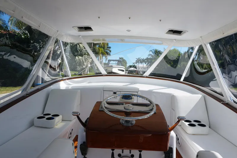  Yacht Photos Pics Interior view of 2010 Scopinich 35 EXPRESS boat with steering wheel and seating.