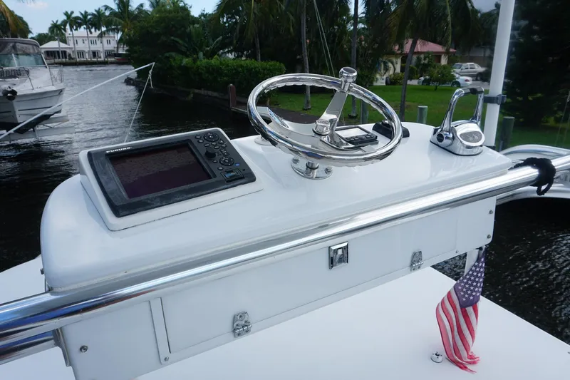  Yacht Photos Pics 2010 Scopinich 35 EXPRESS boat helm with navigation system and American flag.