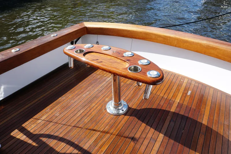  Yacht Photos Pics Wooden deck of 2010 Scopinich 35 EXPRESS boat with fishing rod holders.
