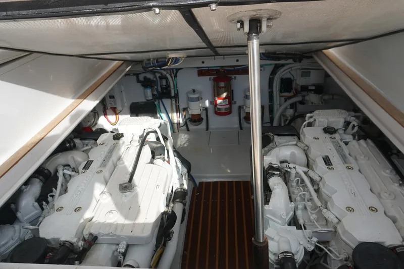  Yacht Photos Pics Engine room of 2010 Scopinich 35 EXPRESS boat with dual engines and fire extinguisher.