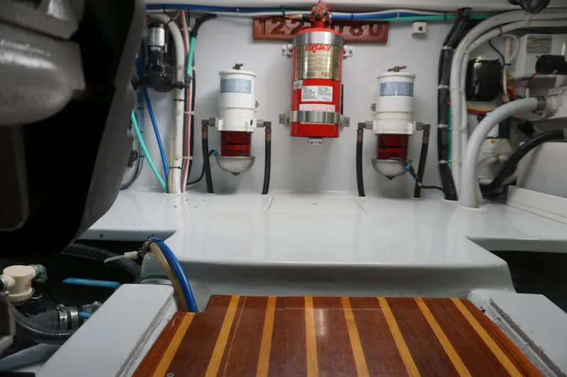  Yacht Photos Pics Engine room of 2010 Scopinich 35 EXPRESS boat with fire extinguisher and filters.