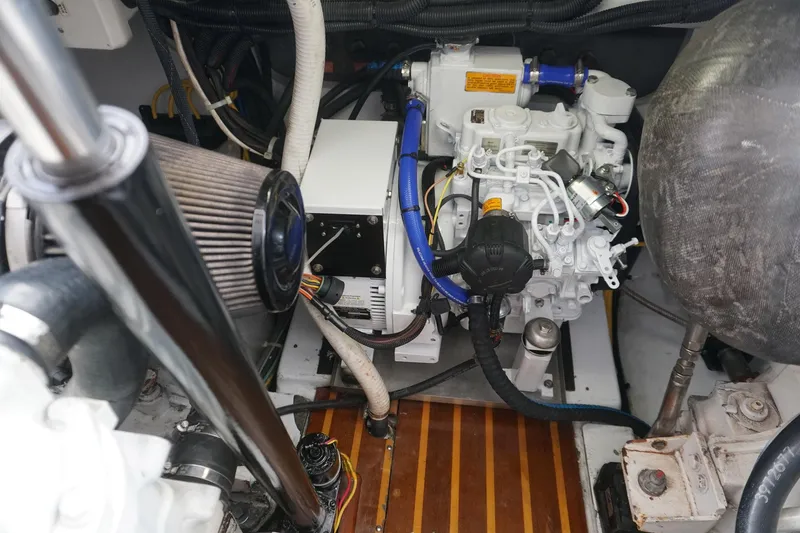  Yacht Photos Pics Engine compartment of a 2010 Scopinich 35 EXPRESS boat, showcasing mechanical components.