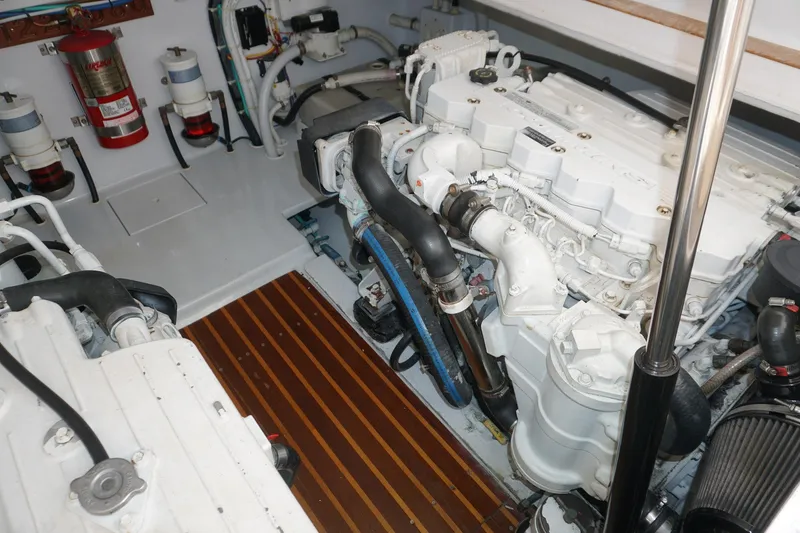  Yacht Photos Pics Engine room of 2010 Scopinich 35 EXPRESS with visible machinery and fire extinguisher.