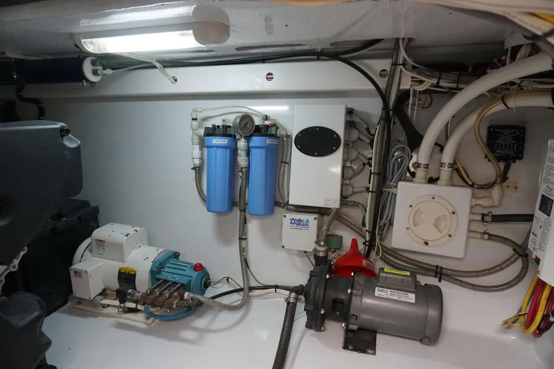  Yacht Photos Pics Engine room of 2010 Scopinich 35 EXPRESS with water filtration system and mechanical components.
