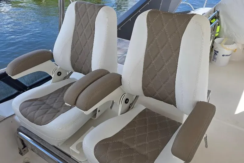 Blue Bird Yacht Photos Pics Luxurious seating on 2008 Neptunus Flybridge MY yacht, featuring quilted upholstery.