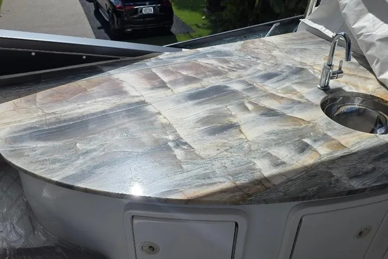 Blue Bird Yacht Photos Pics Luxurious marble countertop with sink on 2008 Neptunus Flybridge MY yacht.