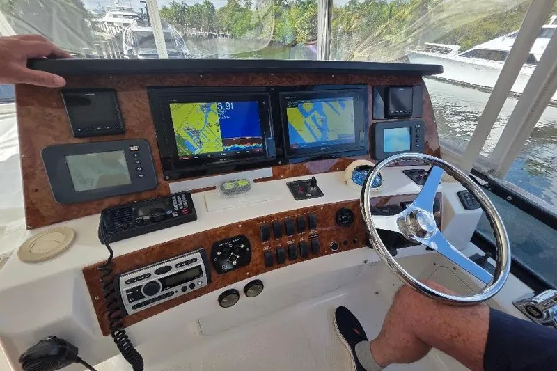 Blue Bird Yacht Photos Pics Helm of 2008 Neptunus Flybridge MY with navigation screens and controls.