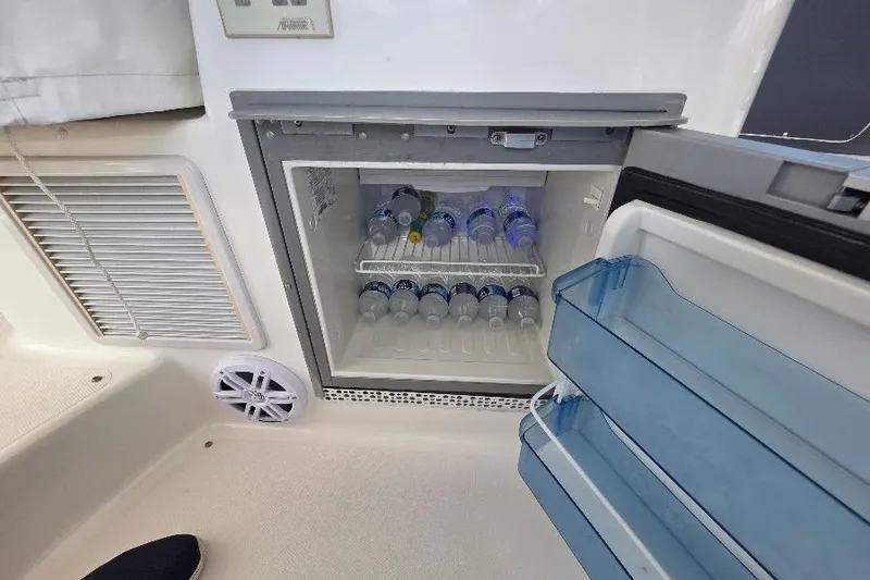 Blue Bird Yacht Photos Pics Mini fridge stocked with water bottles on a 2008 Neptunus Flybridge MY yacht.