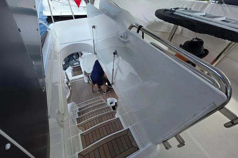 Blue Bird Yacht Photos Pics Staircase on 2008 Neptunus Flybridge MY yacht, featuring sleek design and wooden steps.