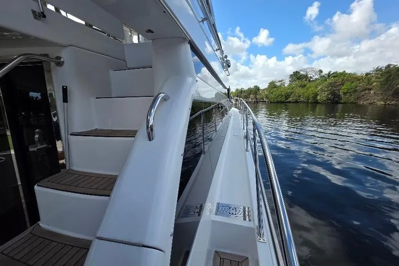 Blue Bird Yacht Photos Pics 2008 Neptunus Flybridge MY yacht with sleek design on a serene waterway.