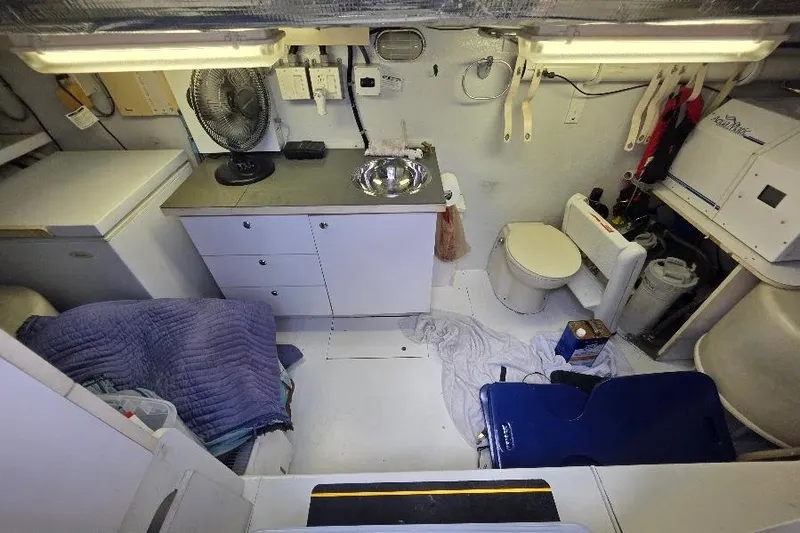 Blue Bird Yacht Photos Pics 2008 Neptunus Flybridge MY yacht interior with kitchenette, sink, and toilet.