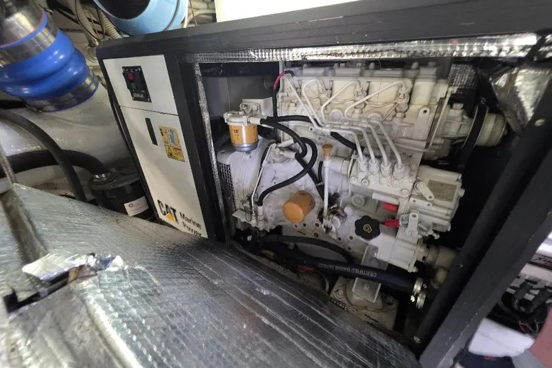 Blue Bird Yacht Photos Pics Engine room of 2008 Neptunus Flybridge MY with CAT marine generator.