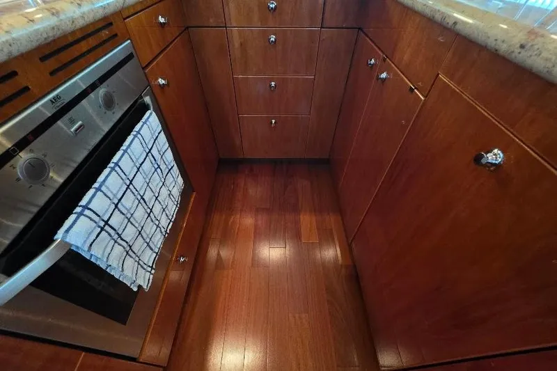 Blue Bird Yacht Photos Pics Luxurious wooden kitchen interior on 2008 Neptunus Flybridge MY yacht.
