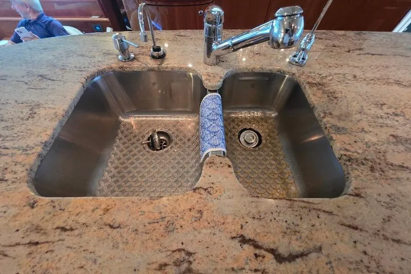 Blue Bird Yacht Photos Pics Stainless steel double sink on Neptunus Flybridge MY 2008 yacht with granite countertop.