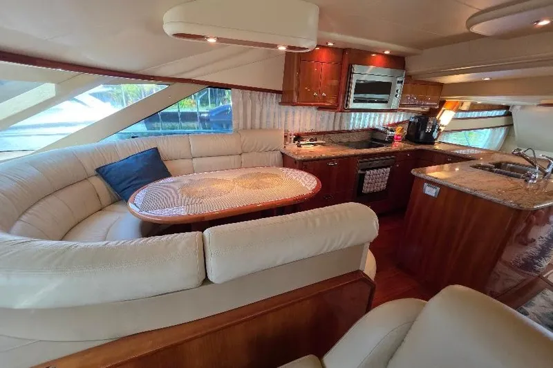 Blue Bird Yacht Photos Pics Luxurious interior of 2008 Neptunus Flybridge MY yacht with elegant seating and modern kitchen.