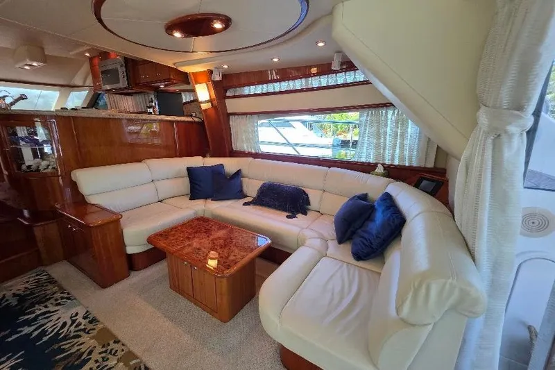 Blue Bird Yacht Photos Pics Luxurious interior of 2008 Neptunus Flybridge MY yacht with plush seating and elegant decor.
