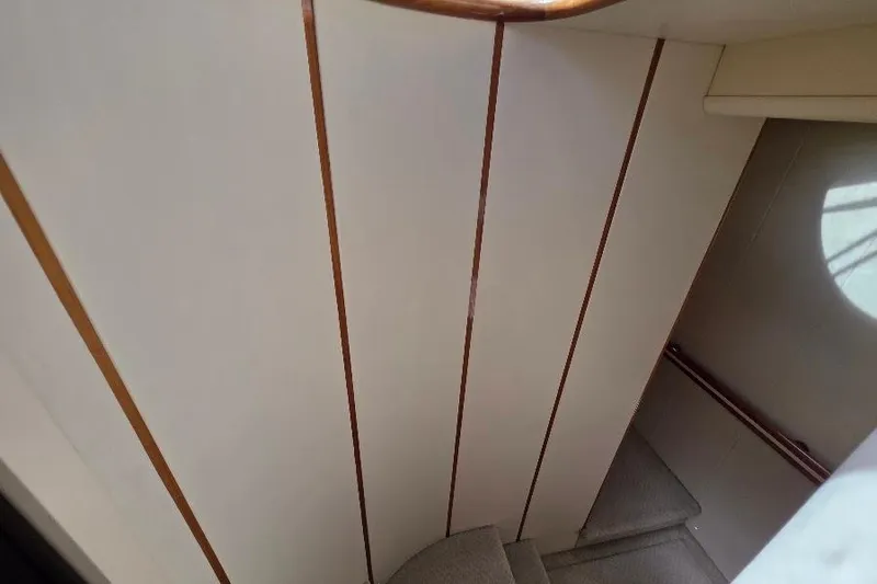 Blue Bird Yacht Photos Pics Staircase inside 2008 Neptunus Flybridge MY yacht with wooden accents.