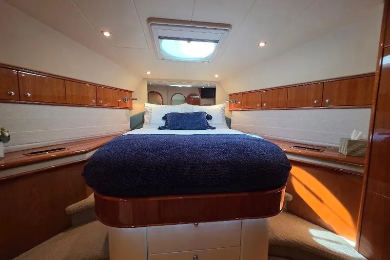 Blue Bird Yacht Photos Pics Luxurious cabin interior of 2008 Neptunus Flybridge MY yacht with elegant wood finishes.