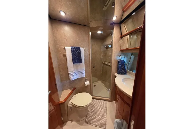 Blue Bird Yacht Photos Pics Luxurious bathroom in 2008 Neptunus Flybridge MY yacht with shower and elegant fixtures.