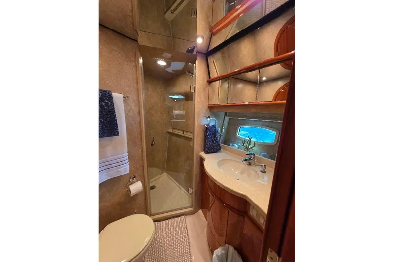 Blue Bird Yacht Photos Pics Luxurious bathroom in 2008 Neptunus Flybridge MY yacht with shower and vanity.