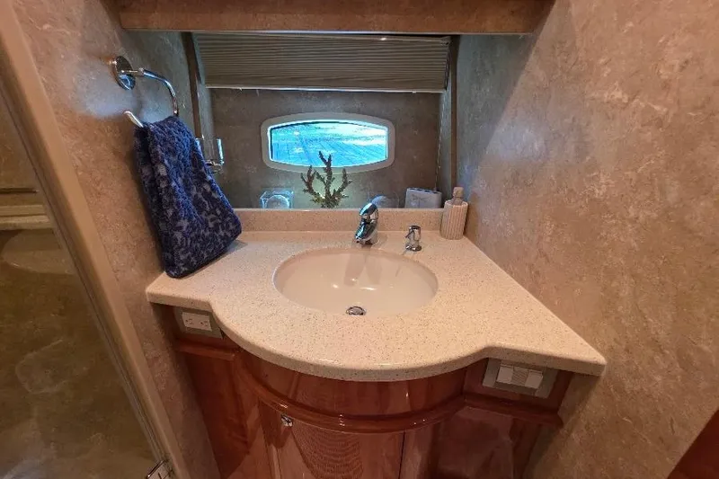 Blue Bird Yacht Photos Pics Luxurious bathroom in 2008 Neptunus Flybridge MY yacht with elegant sink and window view.