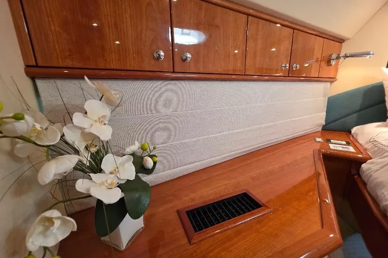 Blue Bird Yacht Photos Pics Luxurious Neptunus Flybridge MY 2008 interior with elegant wood cabinetry and floral decor.
