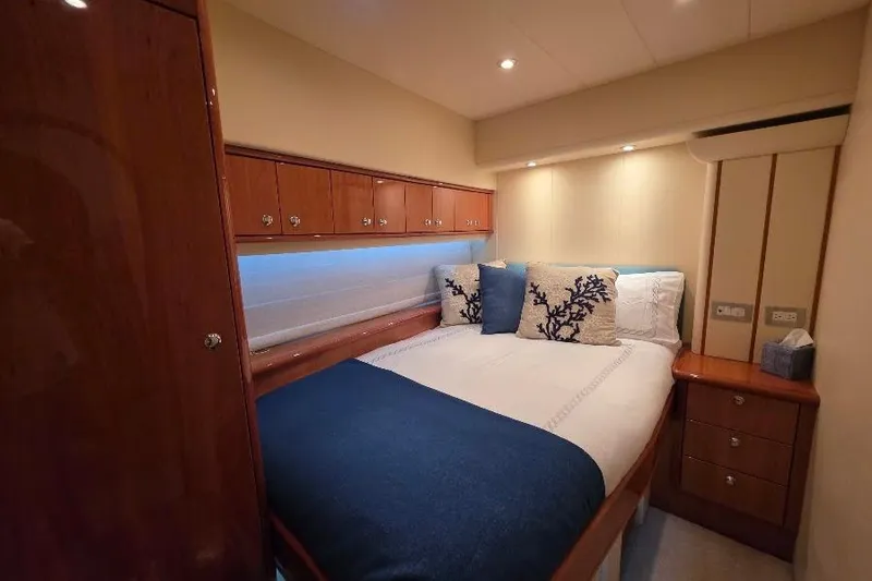 Blue Bird Yacht Photos Pics Luxurious bedroom interior of 2008 Neptunus Flybridge MY yacht with elegant wood finishes.