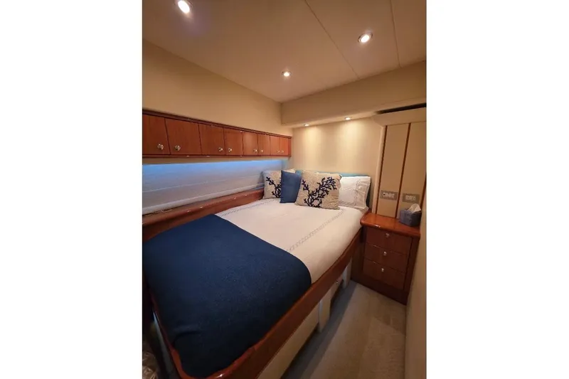 Blue Bird Yacht Photos Pics Luxurious bedroom interior of 2008 Neptunus Flybridge MY yacht with elegant bedding.