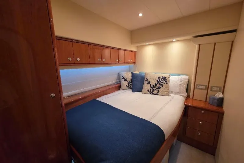 Blue Bird Yacht Photos Pics Luxurious cabin interior of 2008 Neptunus Flybridge MY yacht with elegant bedding.
