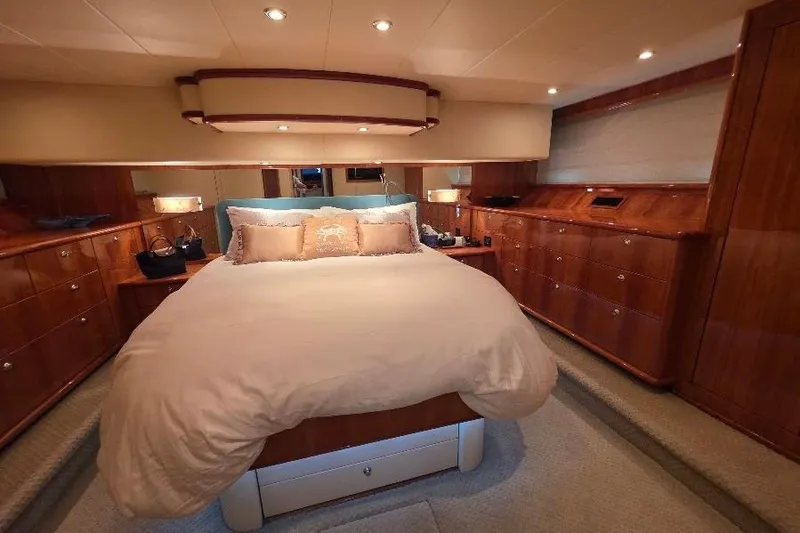 Blue Bird Yacht Photos Pics Luxurious bedroom interior of 2008 Neptunus Flybridge MY yacht with elegant wood finish.
