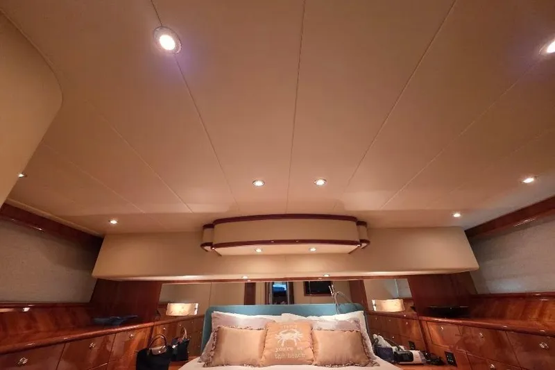 Blue Bird Yacht Photos Pics Luxurious interior of 2008 Neptunus Flybridge MY yacht with elegant lighting and wood accents.