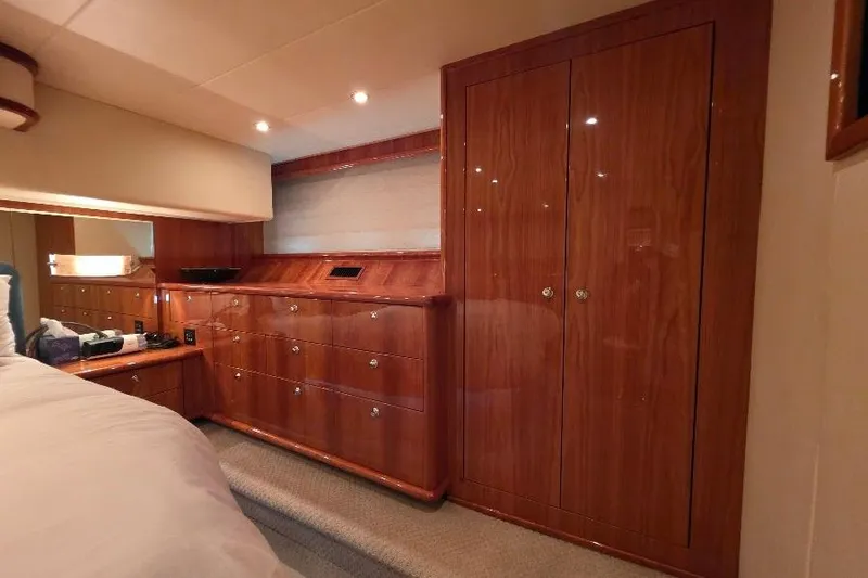 Blue Bird Yacht Photos Pics Luxurious wood-paneled cabin interior of 2008 Neptunus Flybridge MY yacht.