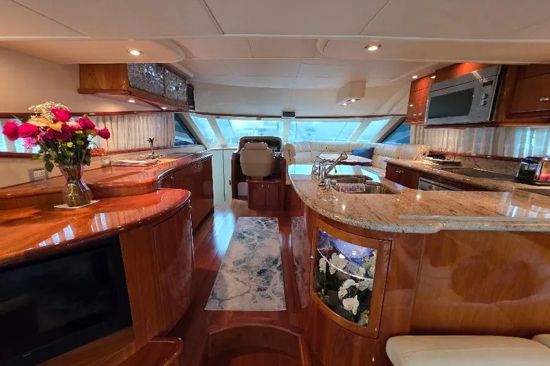 Blue Bird Yacht Photos Pics Luxurious interior of 2008 Neptunus Flybridge MY yacht with elegant wood finishes and modern amenities.