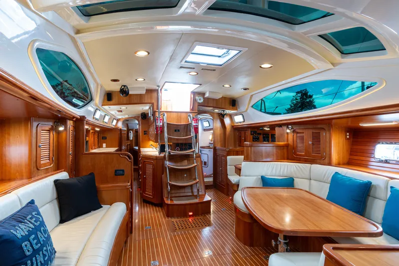 Solitude Yacht Photos Pics Luxurious interior of 2018 Passport Vista 545 Center Cockpit yacht with elegant wood finish.