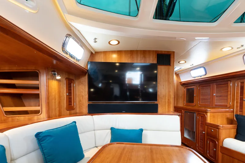 Solitude Yacht Photos Pics Luxurious interior of 2018 Passport Vista 545 yacht with wood finish and skylights.