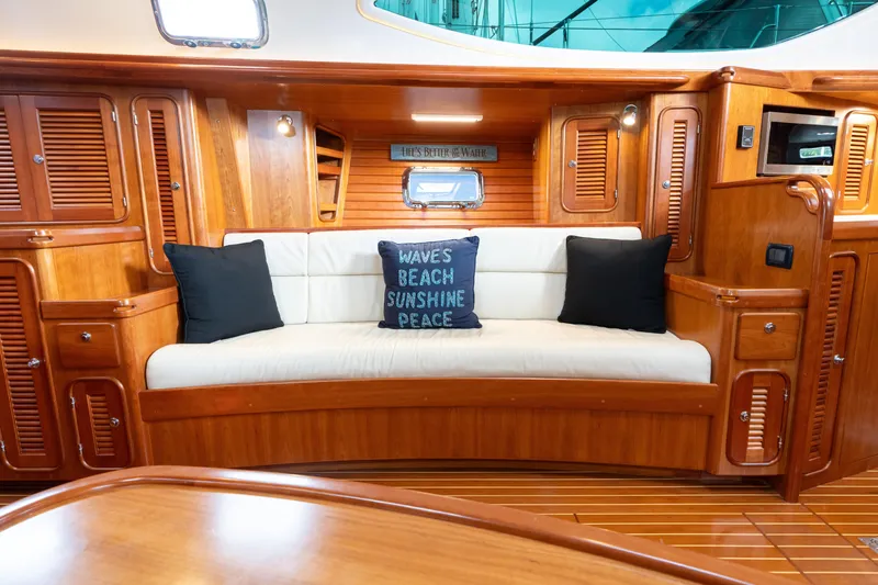 Solitude Yacht Photos Pics Luxurious interior of 2018 Passport Vista 545 Center Cockpit yacht with cozy seating area.