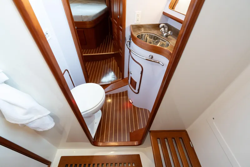 Solitude Yacht Photos Pics Luxurious bathroom in 2018 Passport Vista 545 Center Cockpit yacht with wood accents.