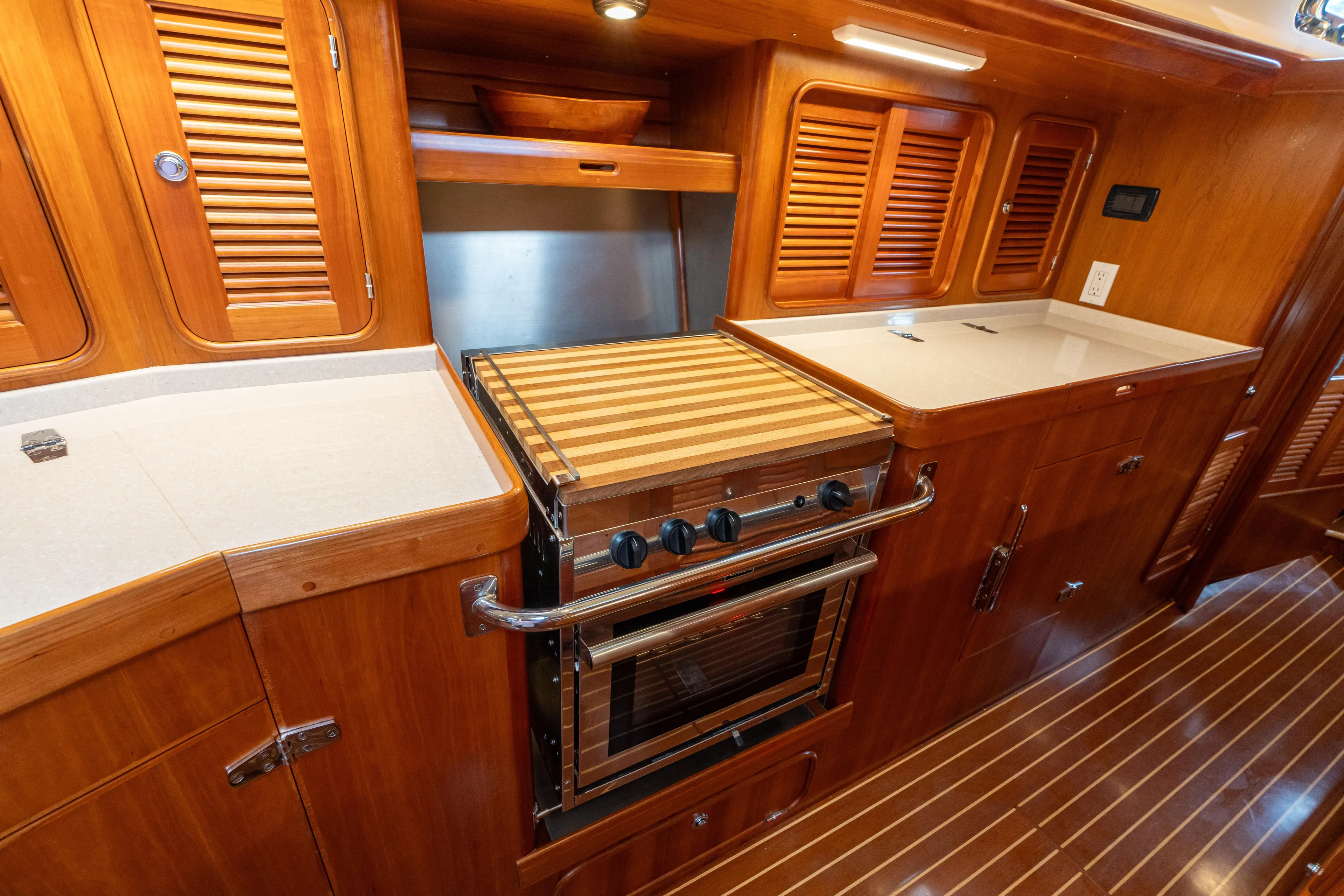 Solitude Yacht Photos Pics Luxurious wooden galley interior of 2018 Passport Vista 545 Center Cockpit yacht.