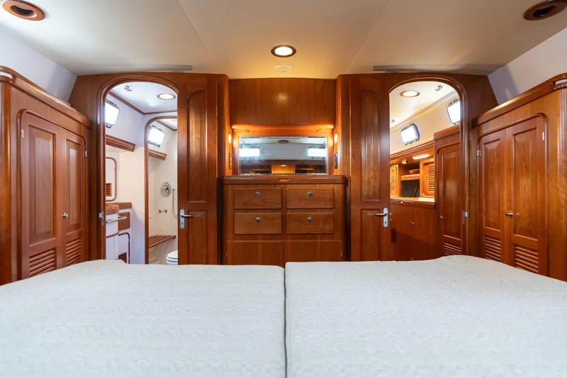 Solitude Yacht Photos Pics Luxurious interior of 2018 Passport Vista 545 Center Cockpit yacht with wooden cabinetry.